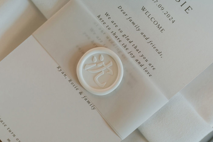 a wax stamp on white wedding stationery