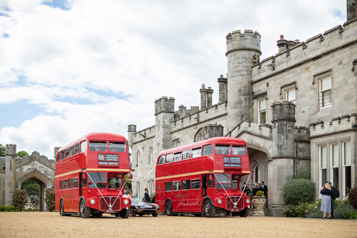 Red buses waiting outside Dundas Castle