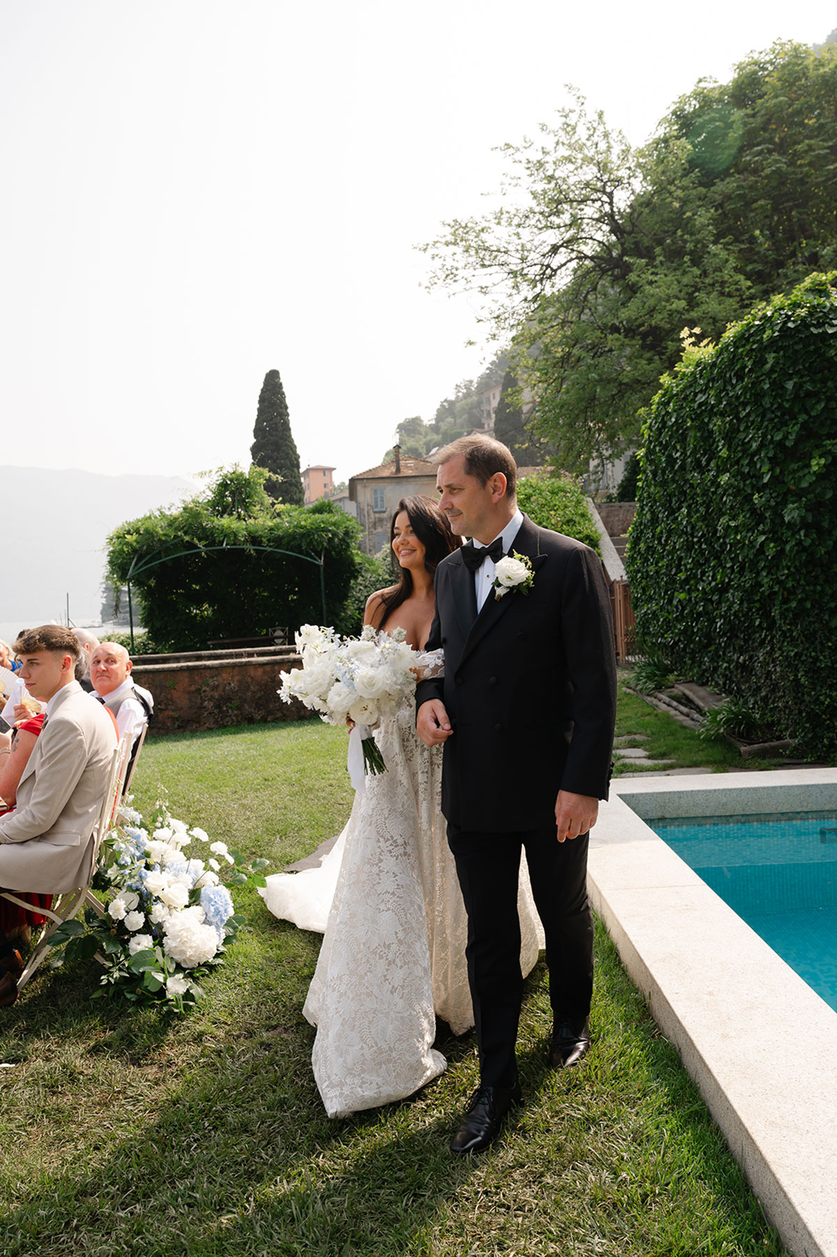 Bride walking down the aisle at Villa Regina Teodolinda during a Lake Como wedding ceremony in Italy