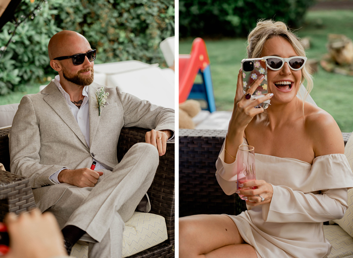 groom wearing beige tweed checked suit relaxing in garden setting on left. Bride wearing ivory sunglasses taking picture with phone in relaxed garden setting on right