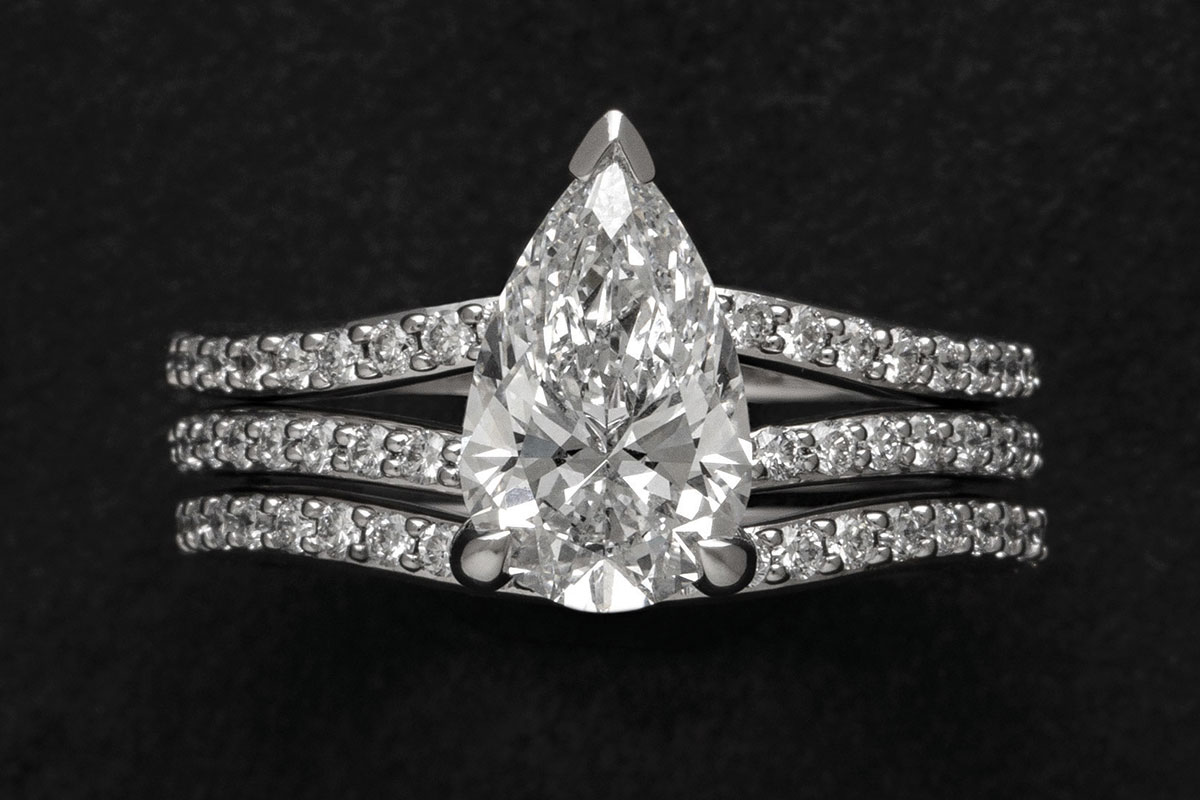 Pear-shaped lab-grown diamond engagement ring with pavé diamond band by James Porter & Son jewellers
