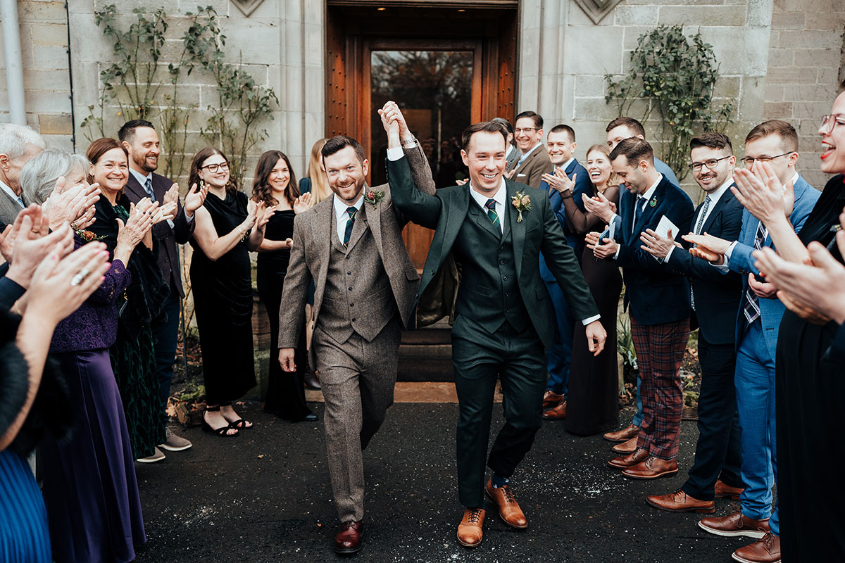 The newlyweds celebrate with guests outside Schloss Roxburghe after their ceremony