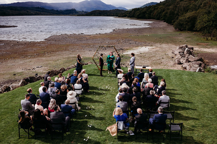Aerial shot of outdoor ceremony of two grooms at Venachar Lochside