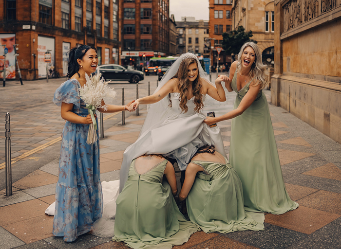 Bride Being Helped By Bridesmaids