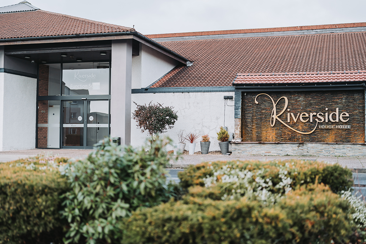 Exterior shot of riverside lodge hotel