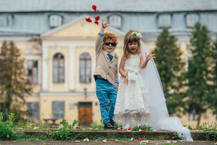 Small boy and girl throwing confetti