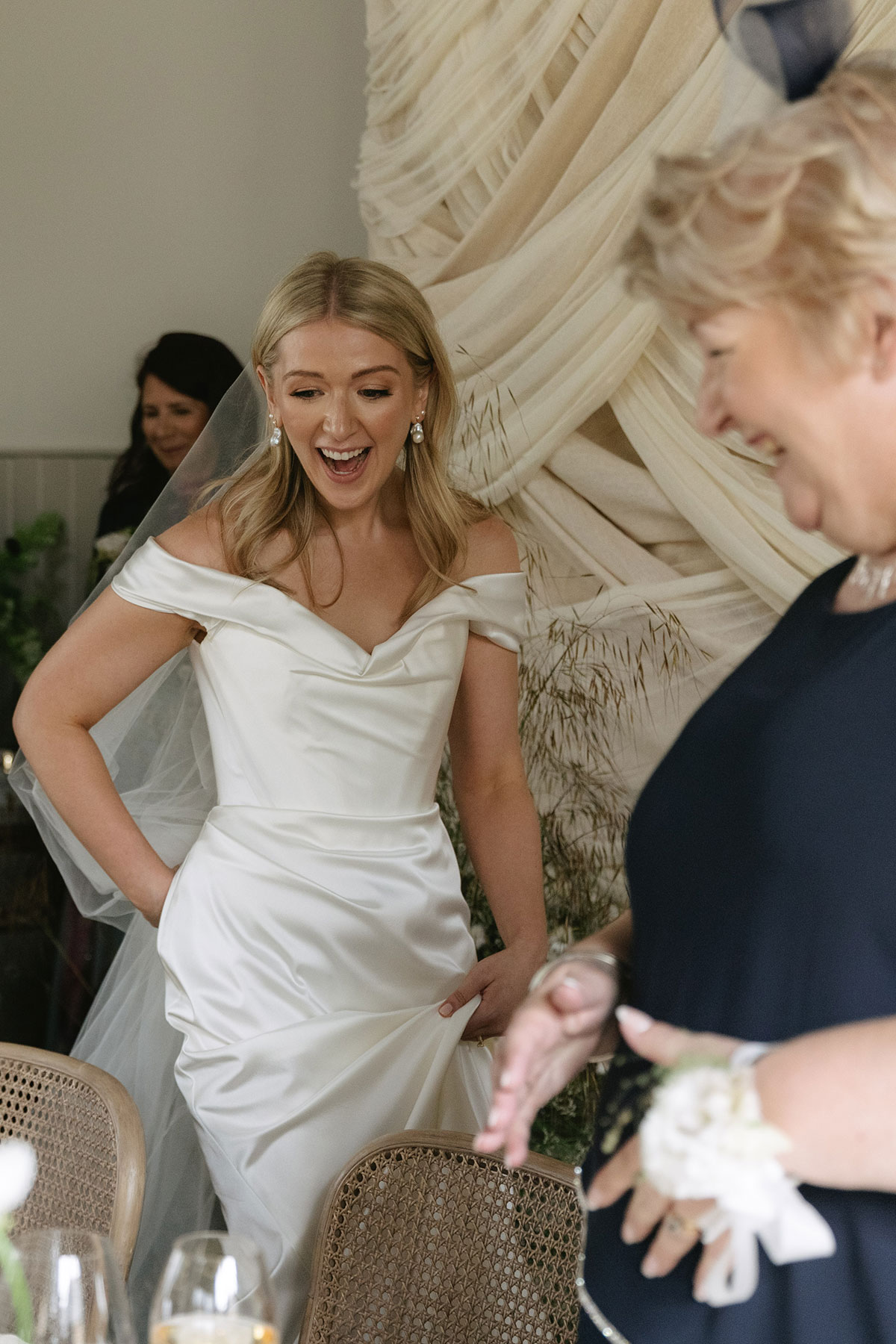 Bride arriving at wedding reception with guests at Gilmerton House East Lothian