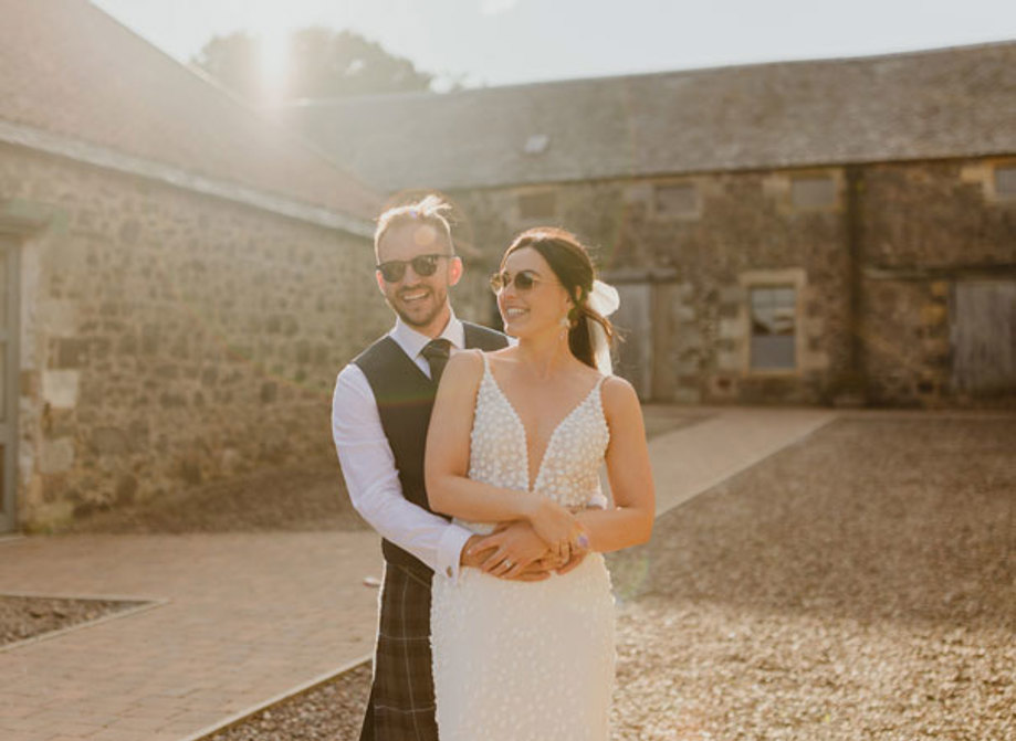 bride and groom wearing sunglasses