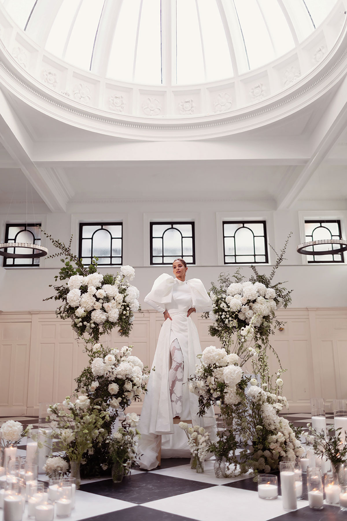 Bride in contemporary puff sleeve wedding gown posing at The Collector’s Hall Glasgow.