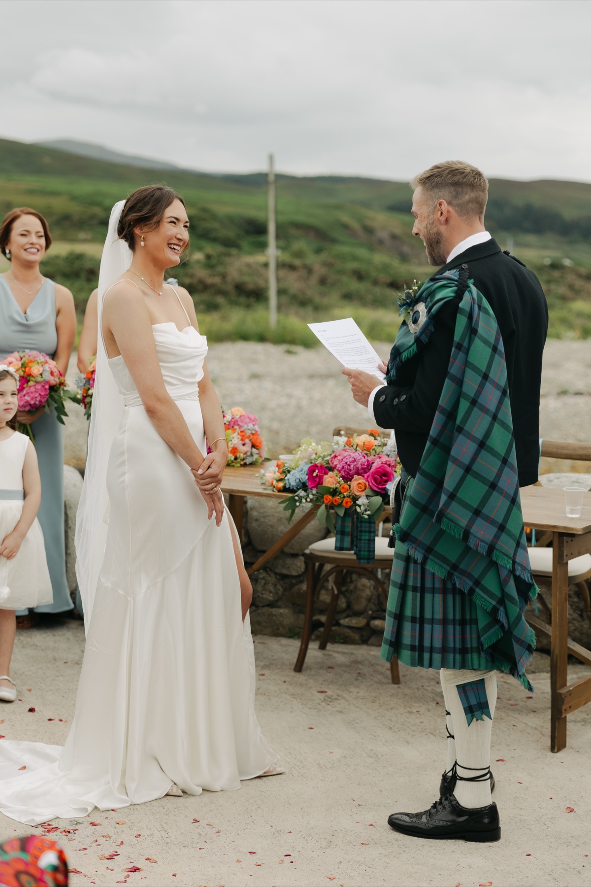 Gary reads his vows to Isobel during their outdoor wedding ceremony at The Dougarie Boathouse, Isle of Arran.