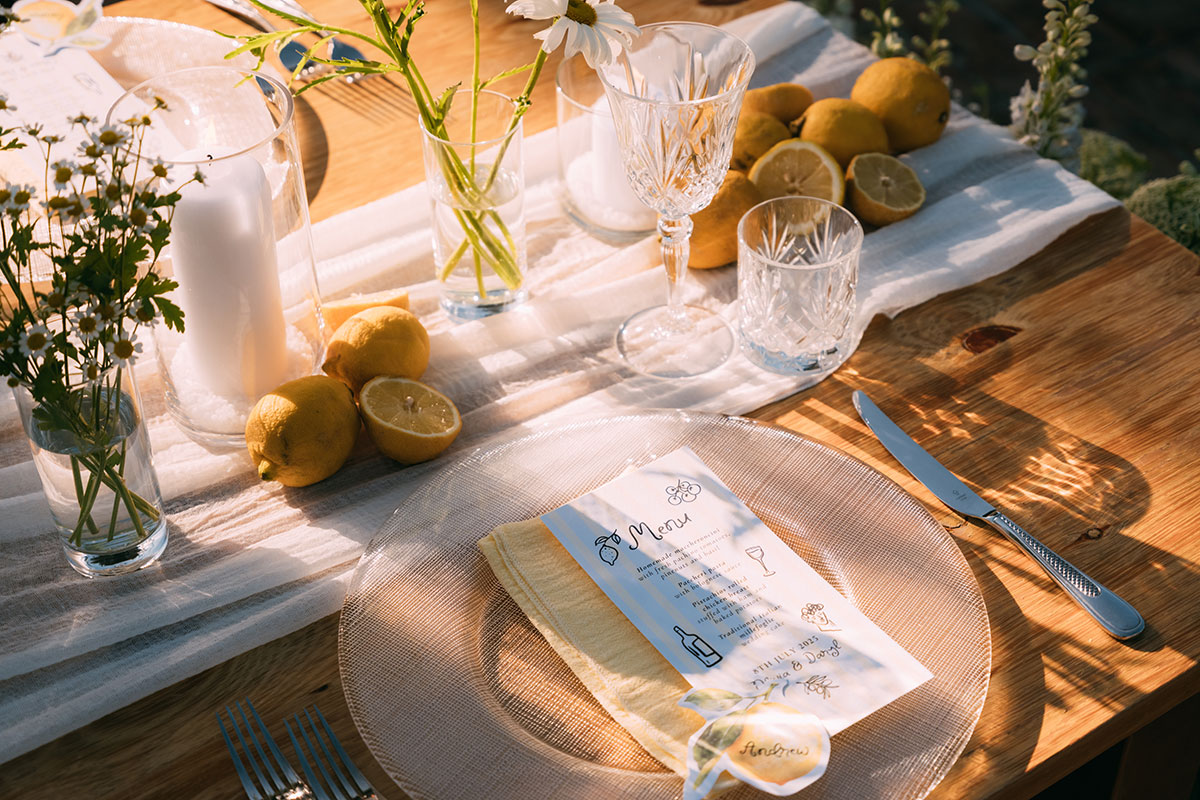 Wedding table setting with lemon decor and stationery at Antico Borgo San Lorenzo Tuscany