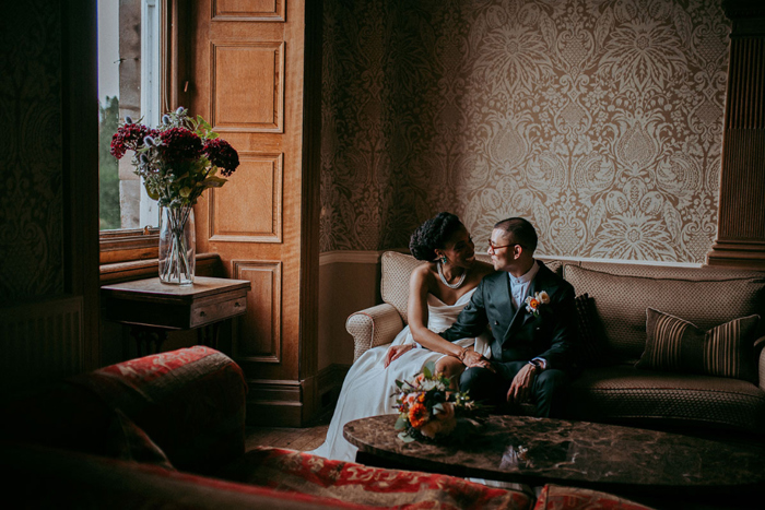 Couple portraits in plush sitting room