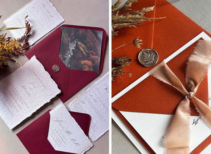Two sets of invitations, on the left in a dark red colour and on the right in a burnt orange colour tied with a peach ribbon