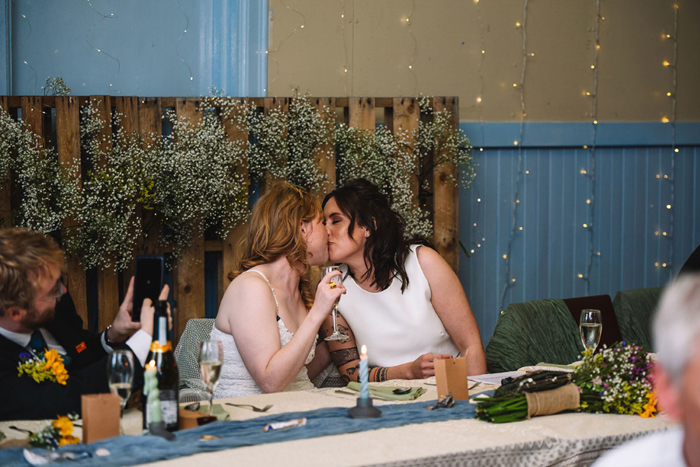 Two Brides Kissing At Portpatrick Village Hall Wedding Reception