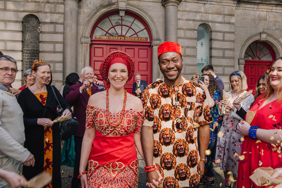 Multicultural Edinburgh religious wedding filled with colourful African  attire and Nigerian, Scottish and Manx traditions