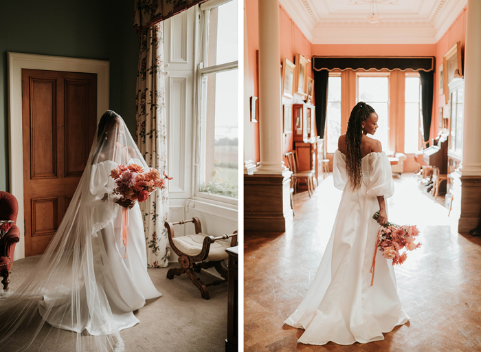 Bride poses inside wedding venue as she stands in her off-the-shoulder wedding dress