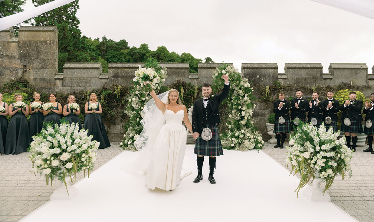 a bride and groom in outdoor wedding ceremony at Dundas Castle