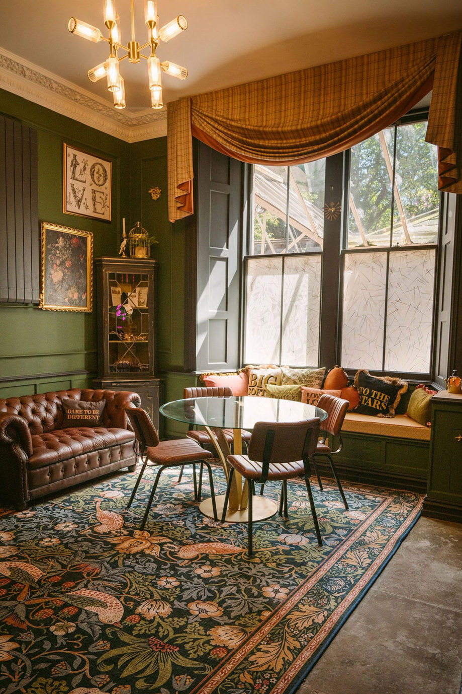 interiors of culdees castle including green paint, brown leather seats and tropical print large rug