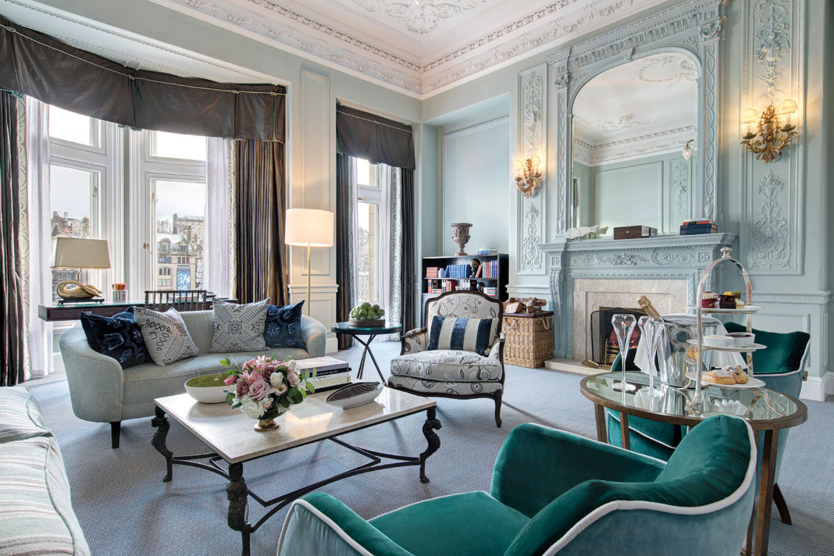 Spacious luxury suite at The Balmoral Edinburgh with period fireplace, elegant furnishings and city views for wedding stays