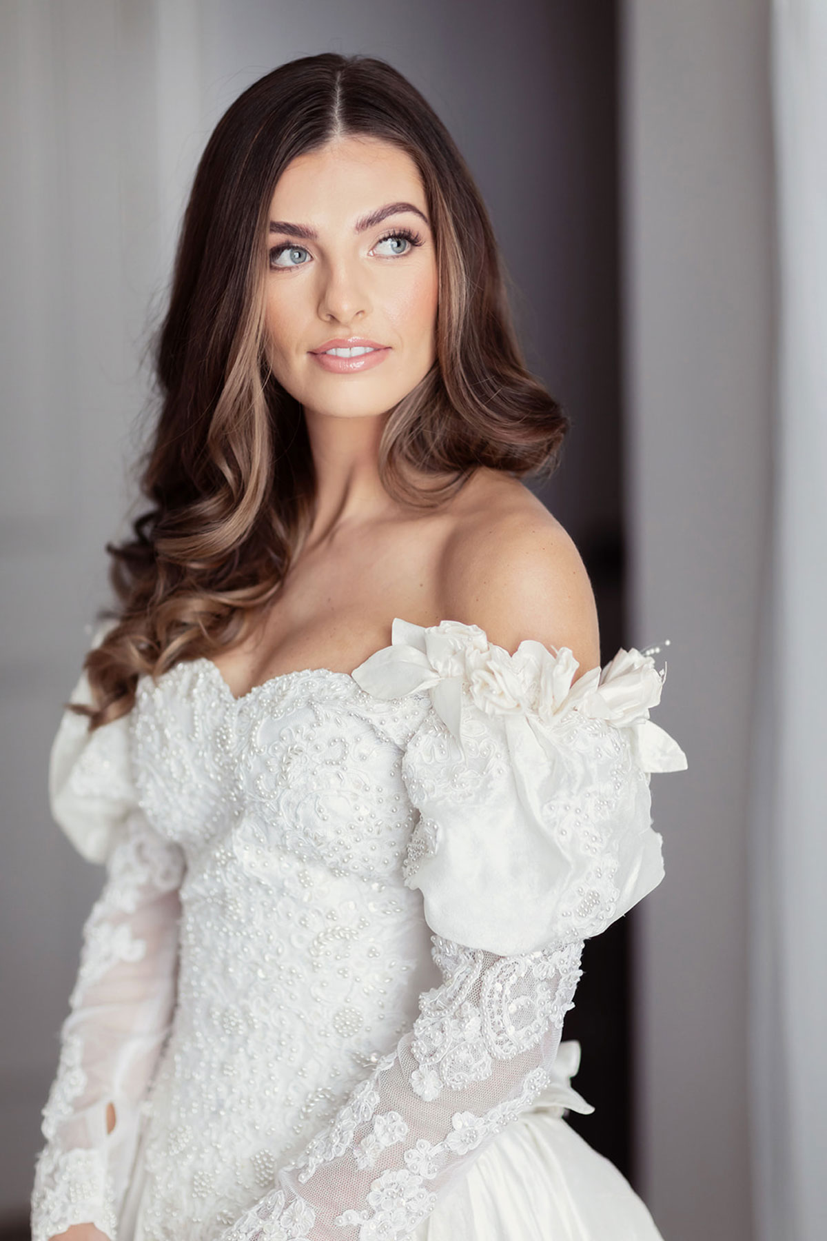 Bridal portrait in beaded off-the-shoulder vintage wedding dress with lace sleeves, photographed at Old Course Hotel Golf Resort & Spa St Andrews