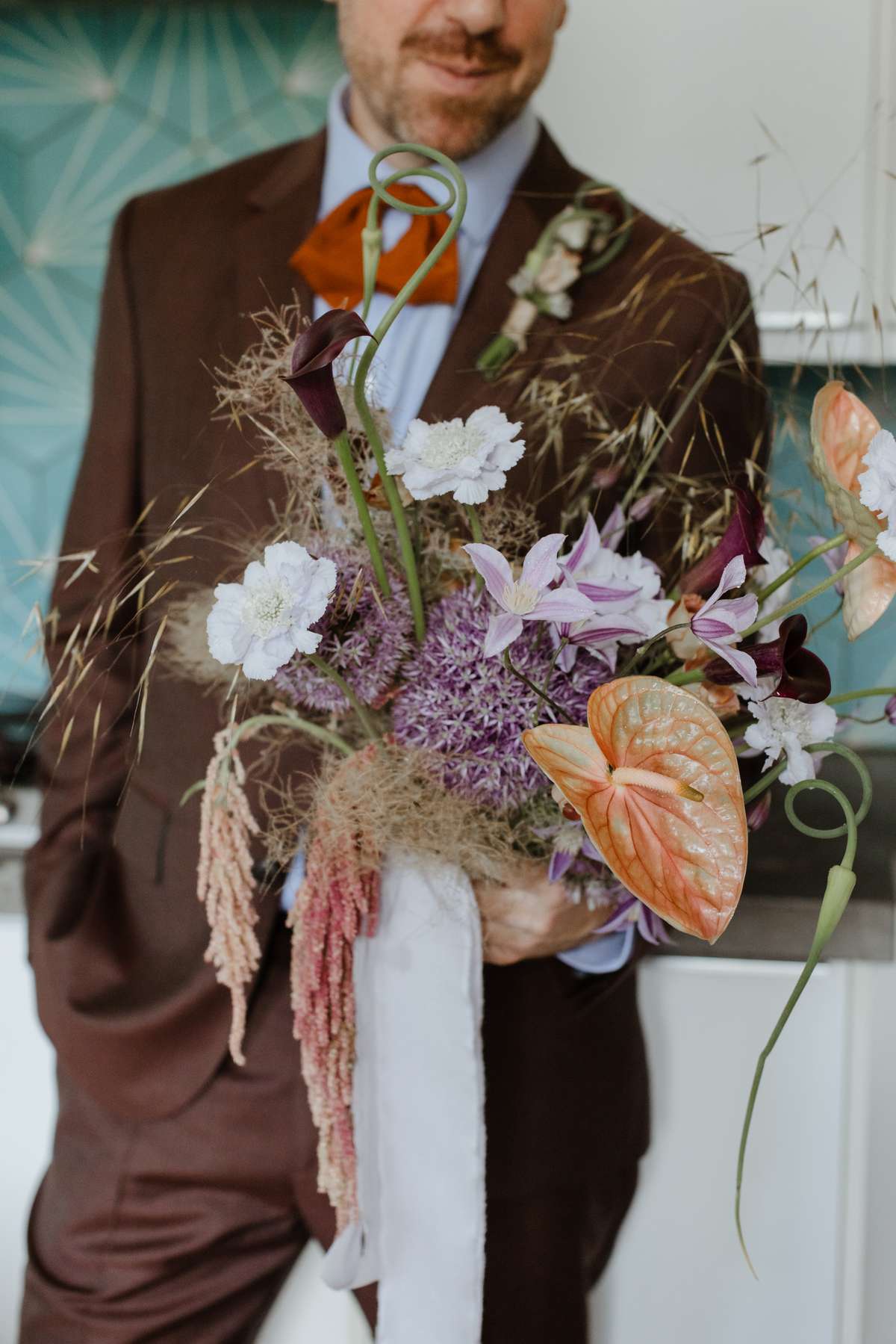 Modern wedding bouquet with anthuriums, alliums and sculptural flowers