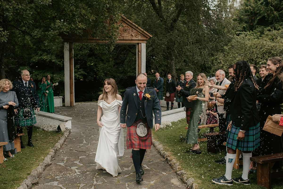 outdoor wedding ceremony at pagoda in grounds of Achnagairn Castle
