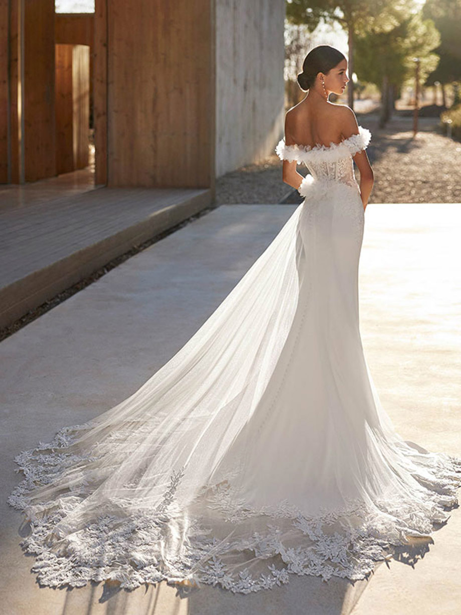 back view of model wearing shimmery off the shoulder wedding dress