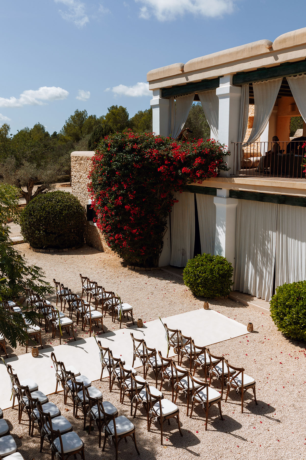 Can Rafal Ibiza wedding ceremony setup with white aisle runner and outdoor seating at luxury Ibiza villa wedding venue