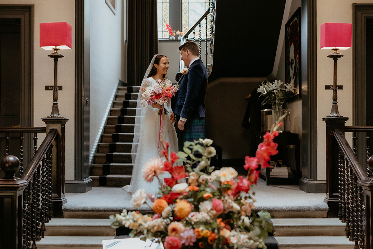 a bride and groom first look at Carlowrie Castle