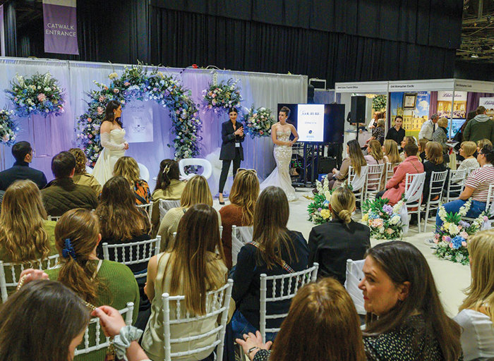 People seated watching a presentation at the Scottish Wedding Show