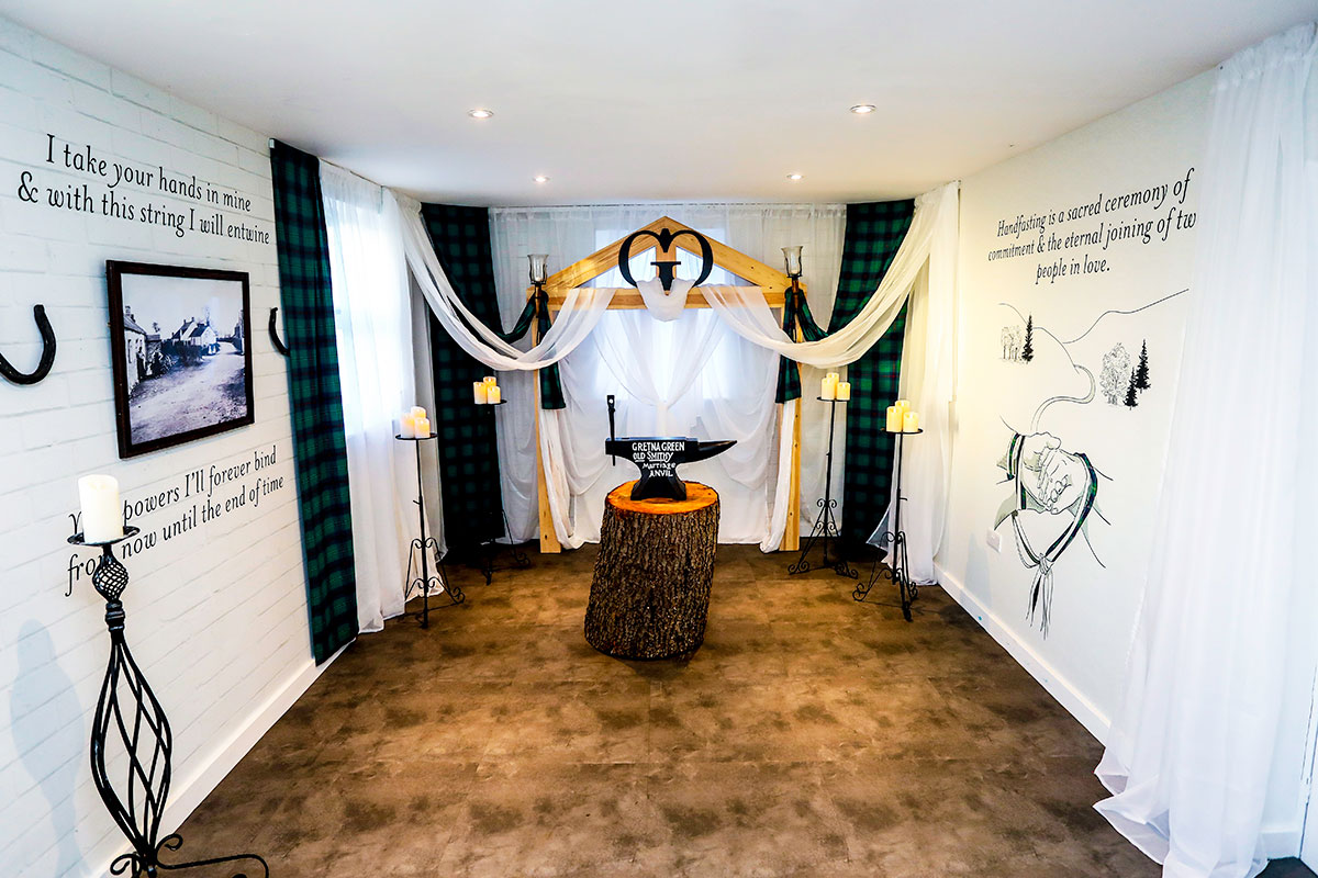 Elopement ceremony room with traditional marriage anvil at the Famous Blacksmiths Shop, Gretna Green.