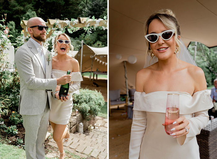 a couple looking happy as they pop a champagne cork in a garden on left. A bride wearing sunglasses and an ivory off-shoulder dress holds a stemless personalised champagne flute on right