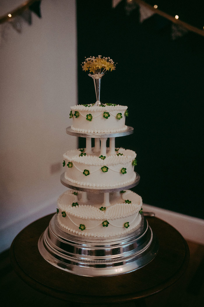 three tier wedding cake with green flowers