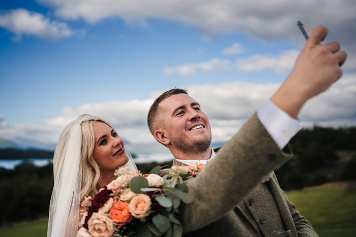 Bride and groom take a selfie