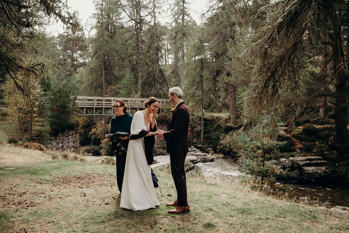 Outdoor wedding ceremony on River Quoich at Mar Lodge Estate