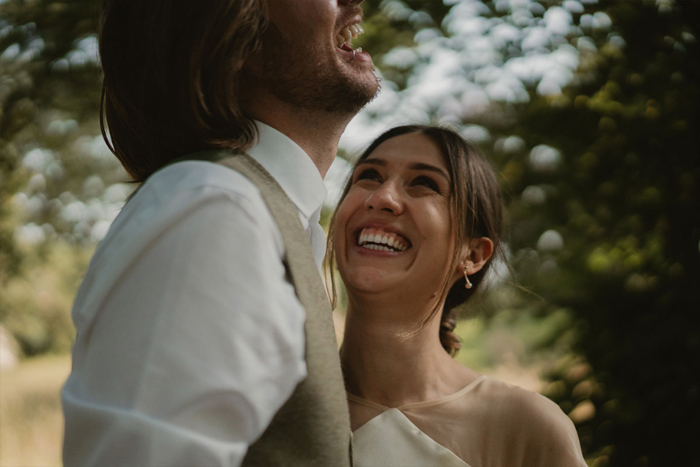 A Bride And Groom Laughing