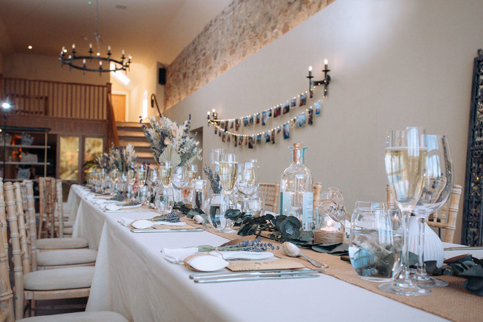 Newhall Mains set for a wedding dinner in rustic blue scheme