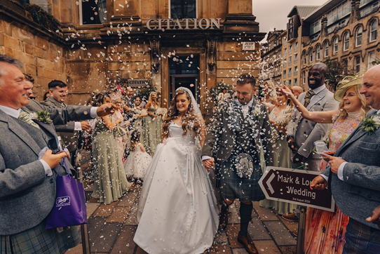 Confetti shot with crowd walking through