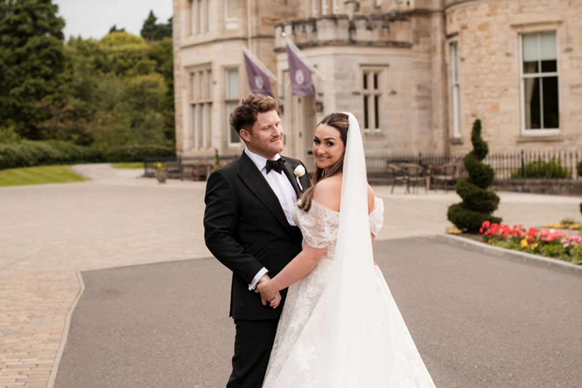 Crossbasket Castle bride and groom outside castle