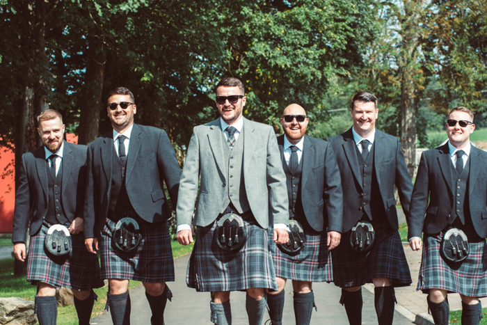 Groom and ushers wearing highland attire