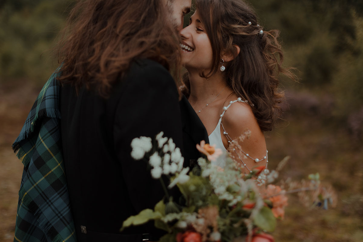 a close up of a bride and groom outdoors at their Carrick Castle Estate wedding