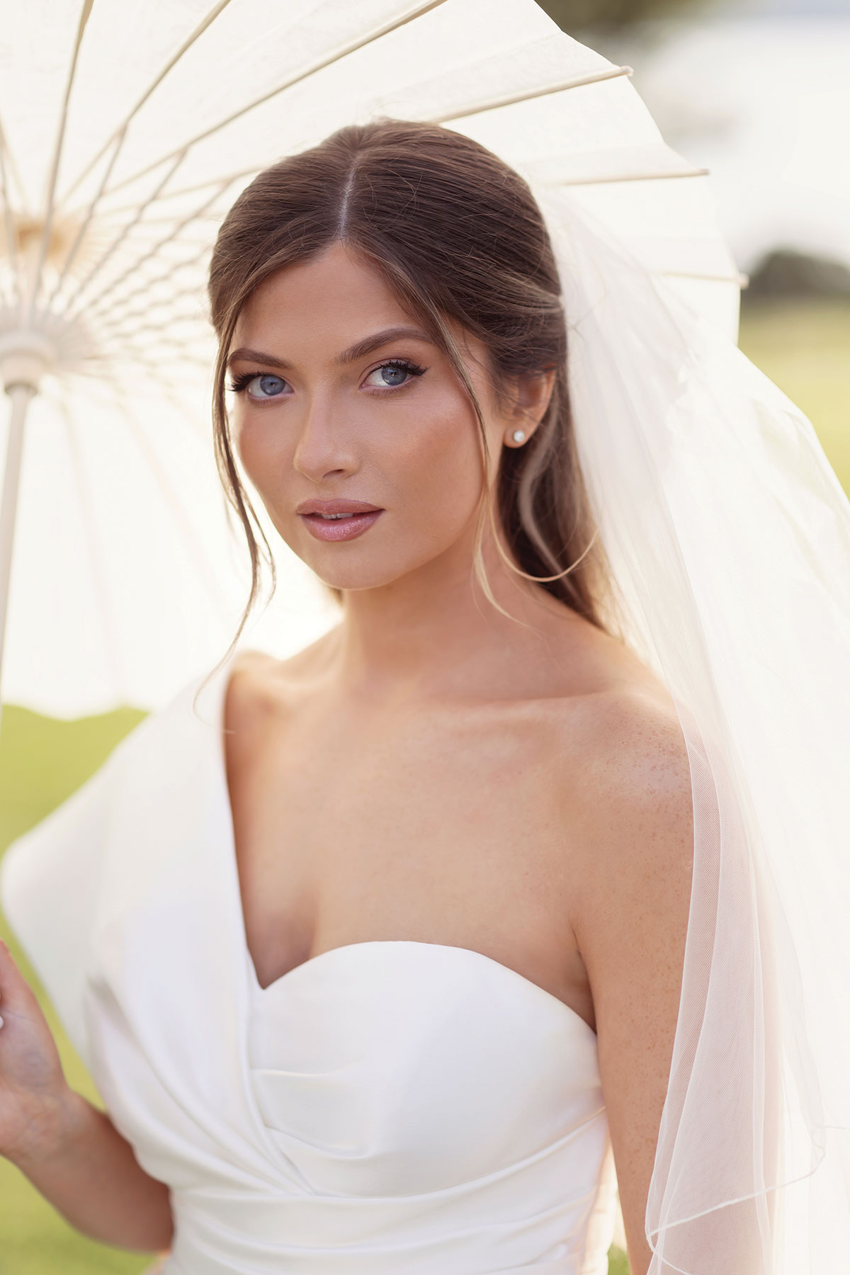 bride up close shot with parasol