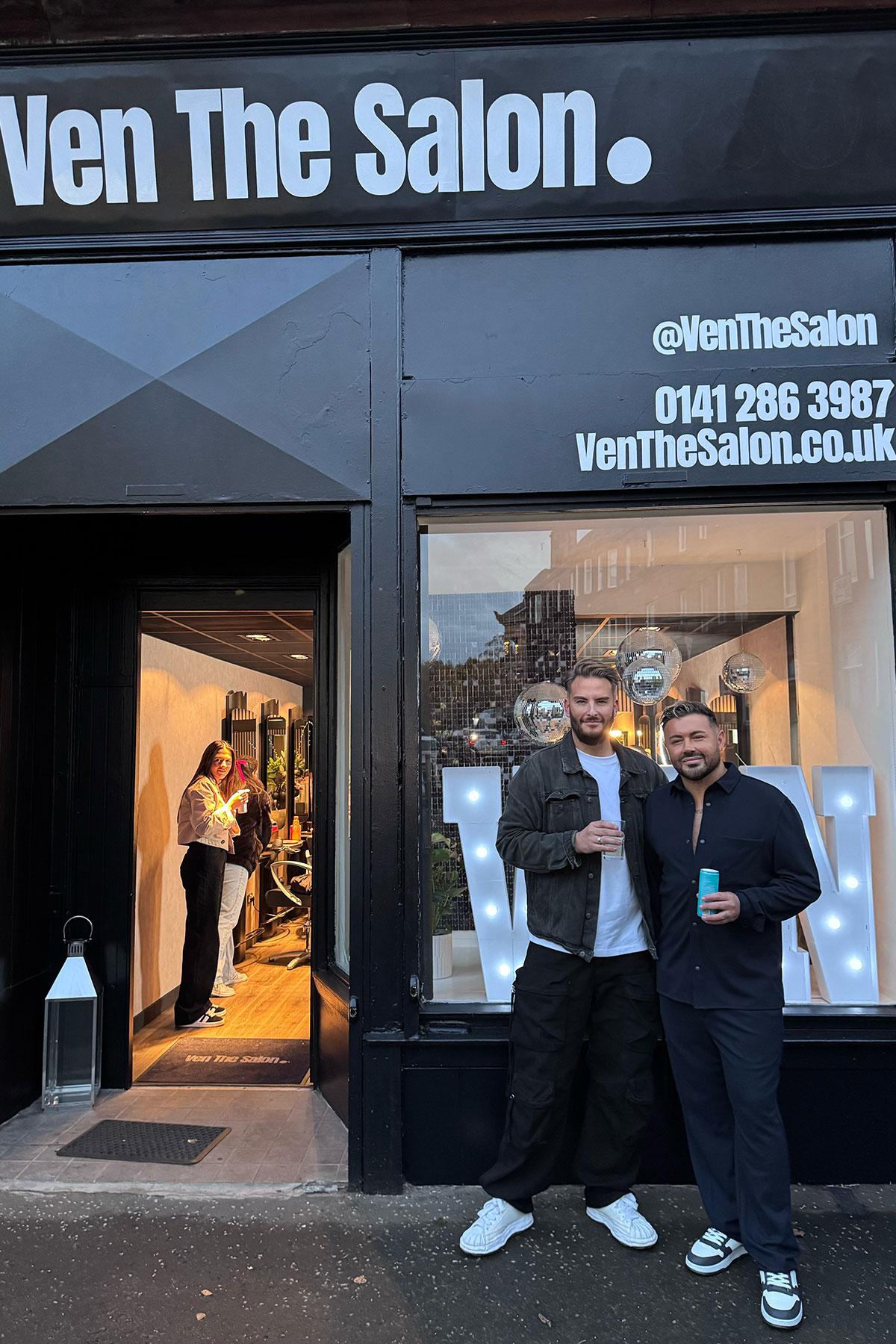 couple stand outside ven the salon in glasgow's southside
