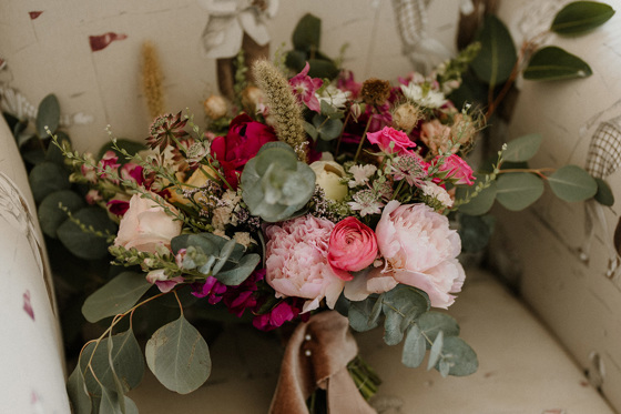 Wildflower bouquet with leaves, peonies and roses