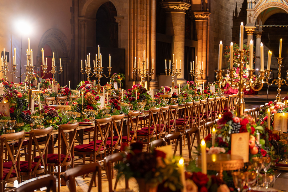 Luxury wedding reception with long tables, colourful flowers and gold candelabras styled by Pebblefish Occasions & Events.