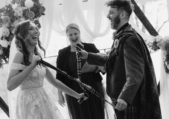 Yvonne Hannah, a humanist celebrant with Fuze Ceremonies, sits at a table on Penicuik Estate.