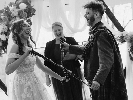 Yvonne Hannah, a humanist celebrant with Fuze Ceremonies, sits at a table on Penicuik Estate.