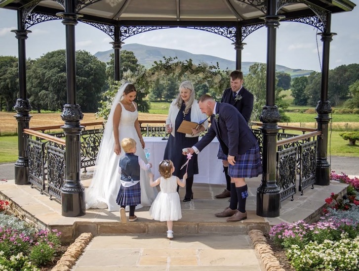 Yvonne Hannah, a humanist celebrant with Fuze Ceremonies, conducts a family wedding at Cornhill Castle