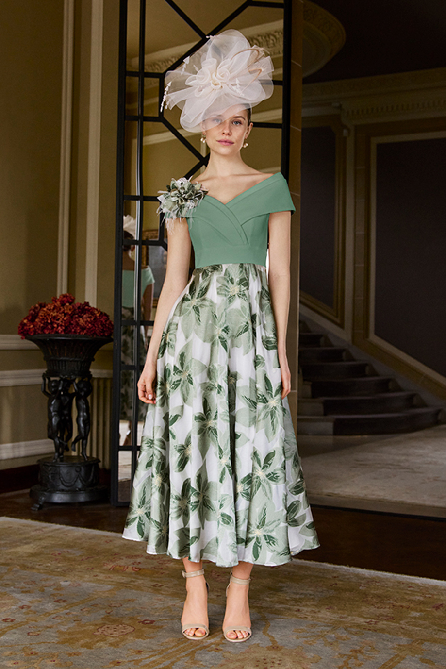 Green and white leaf print midi dress with off-shoulder neckline and fascinator