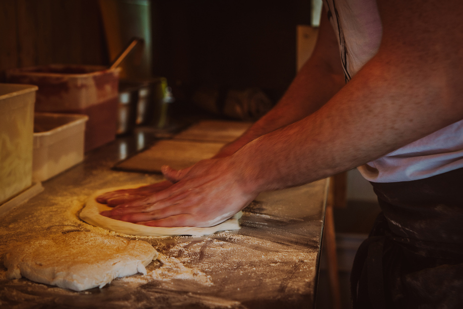 Pizza dough being hand-kneaded in the Dough Man's Land horsebox